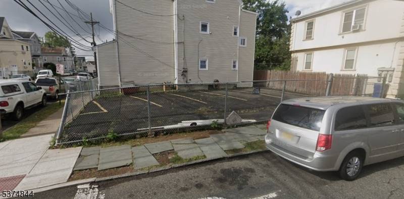 Great two family home, with bonus lot and parking for 5 cars !