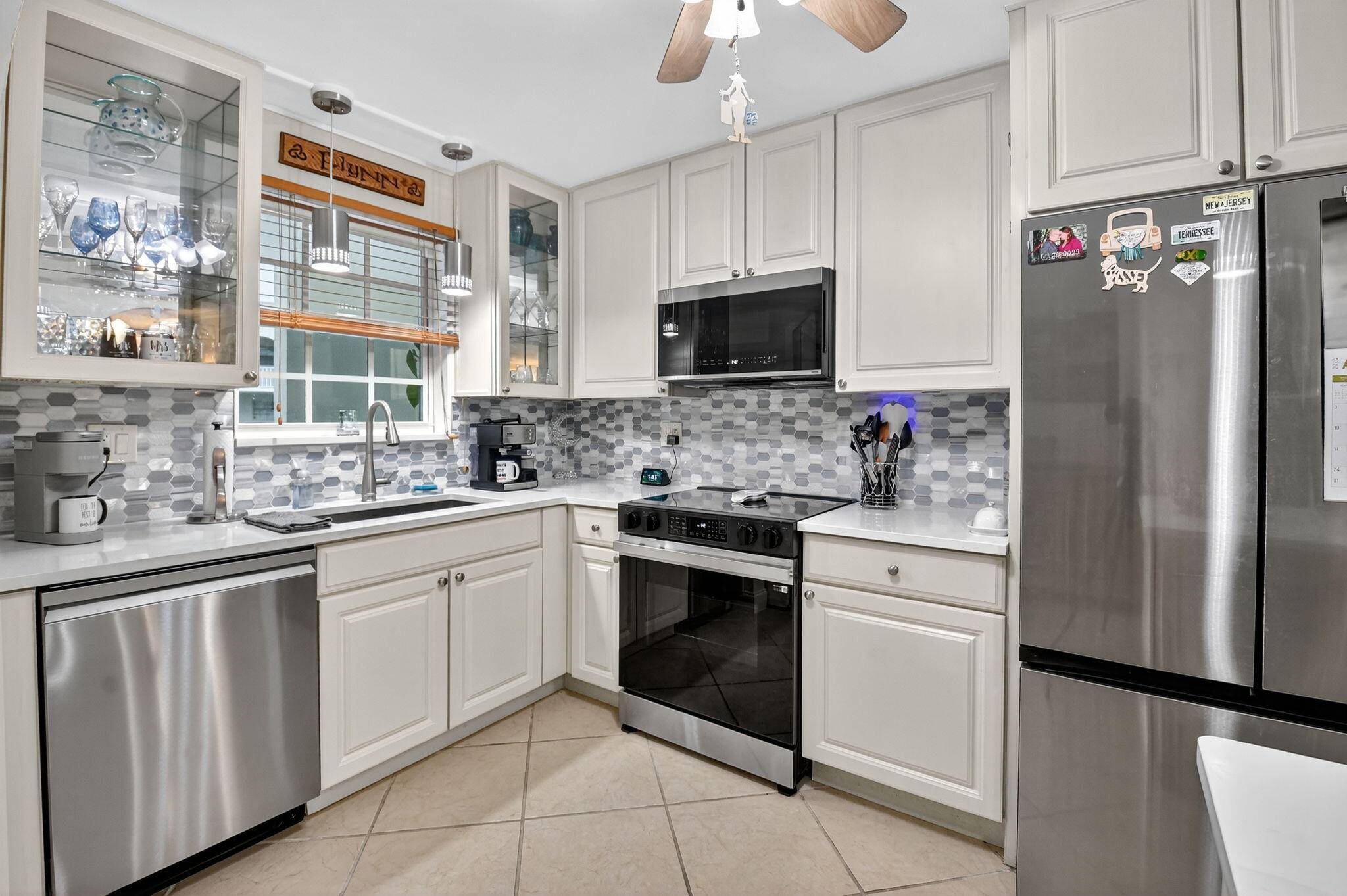Welcome to waterfront living at sun swept Unit 203 in beautifully maintained French Village.