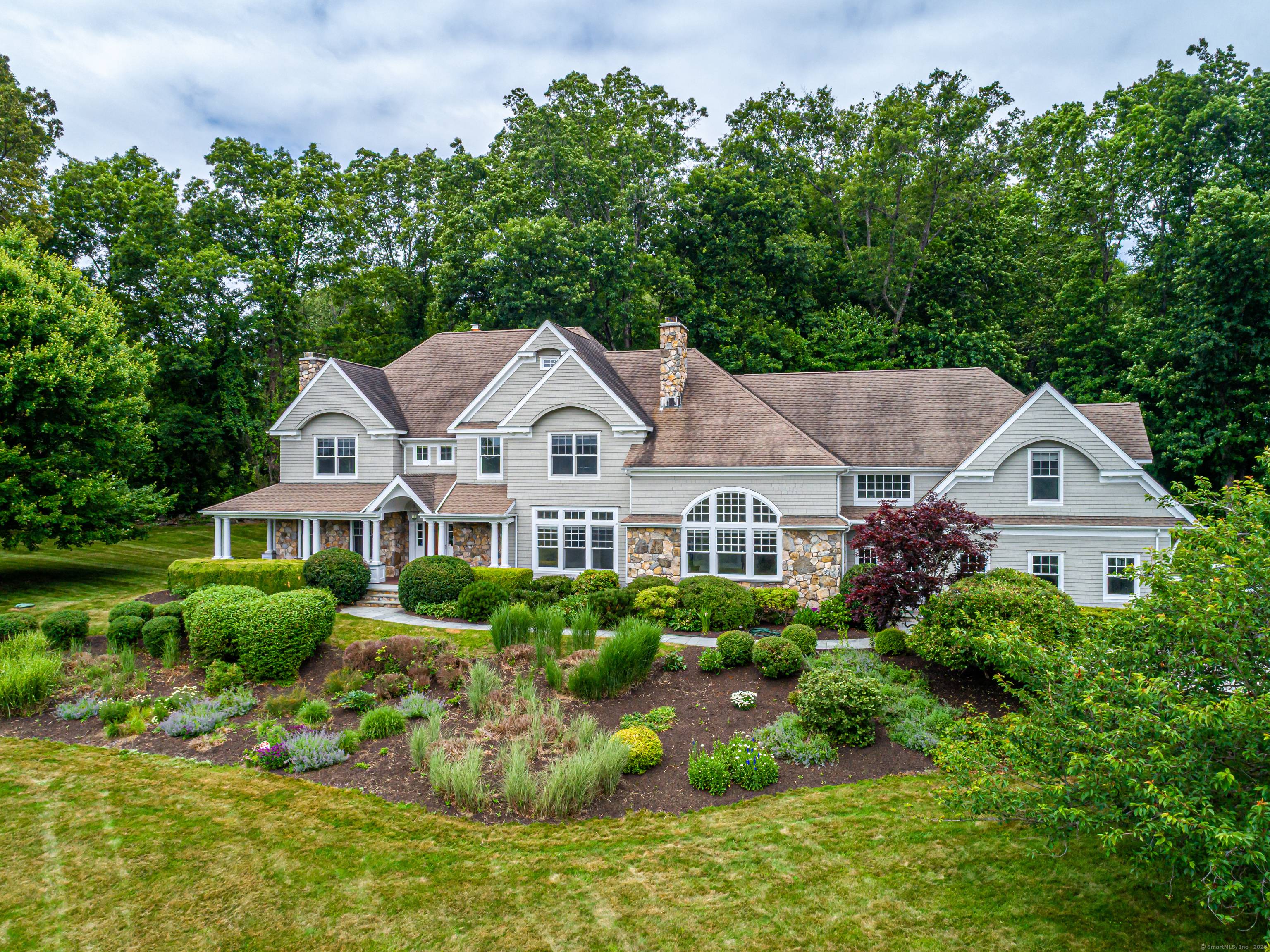 This stunning custom Colonial at 125 Nod Hill Road was crafted by renowned architect Rick Moisan.