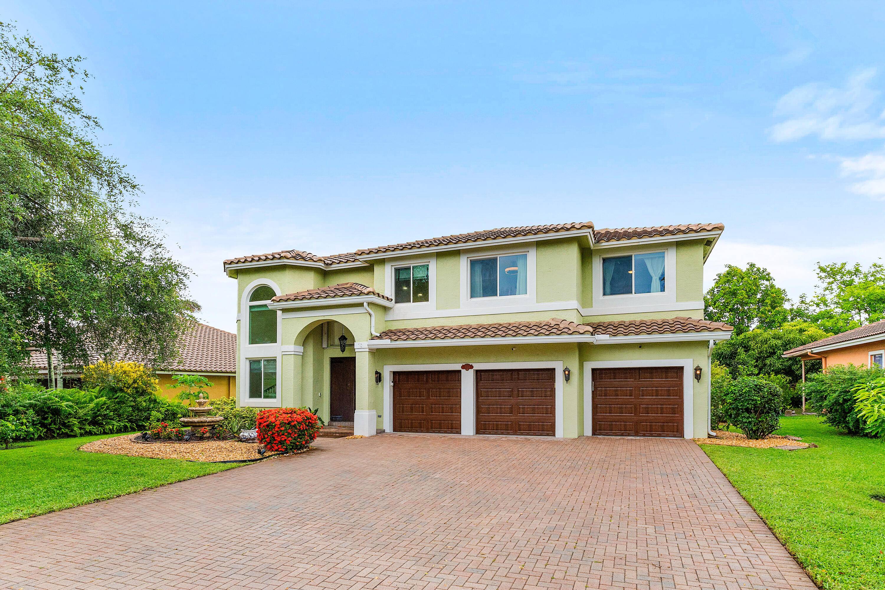 Sophisticated and move in ready 4BR 3BA waterfront home with a brand new roof, pool, and oversized three car garage.