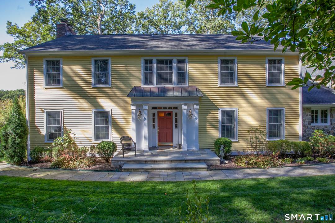 Experience the best of Fairfield County living in this immaculate, sun drenched Colonial, perfectly situated to take in peaceful views of Laurel Lake.