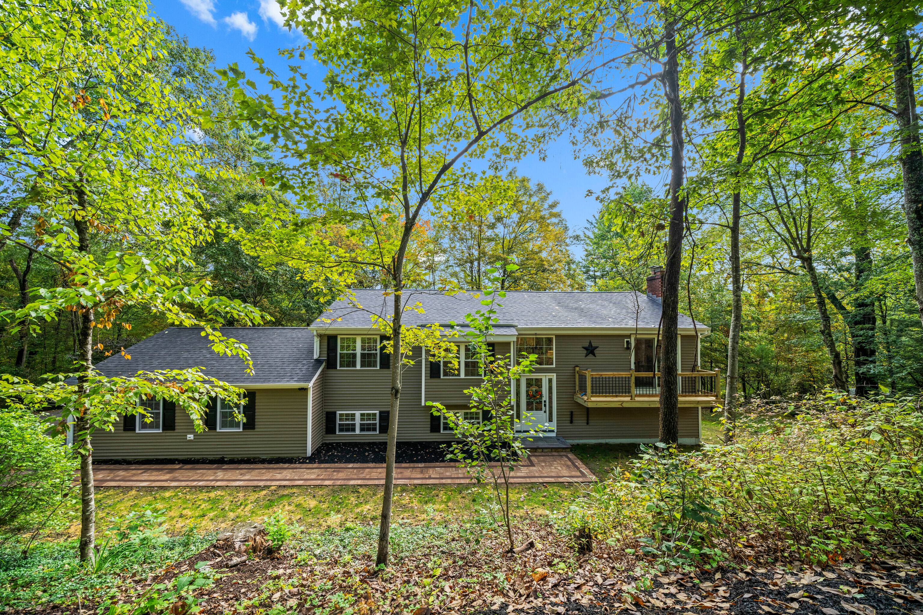 Welcome to 8 Crane Place, a beautiful home tucked away on a private cul de sac in Simsbury.
