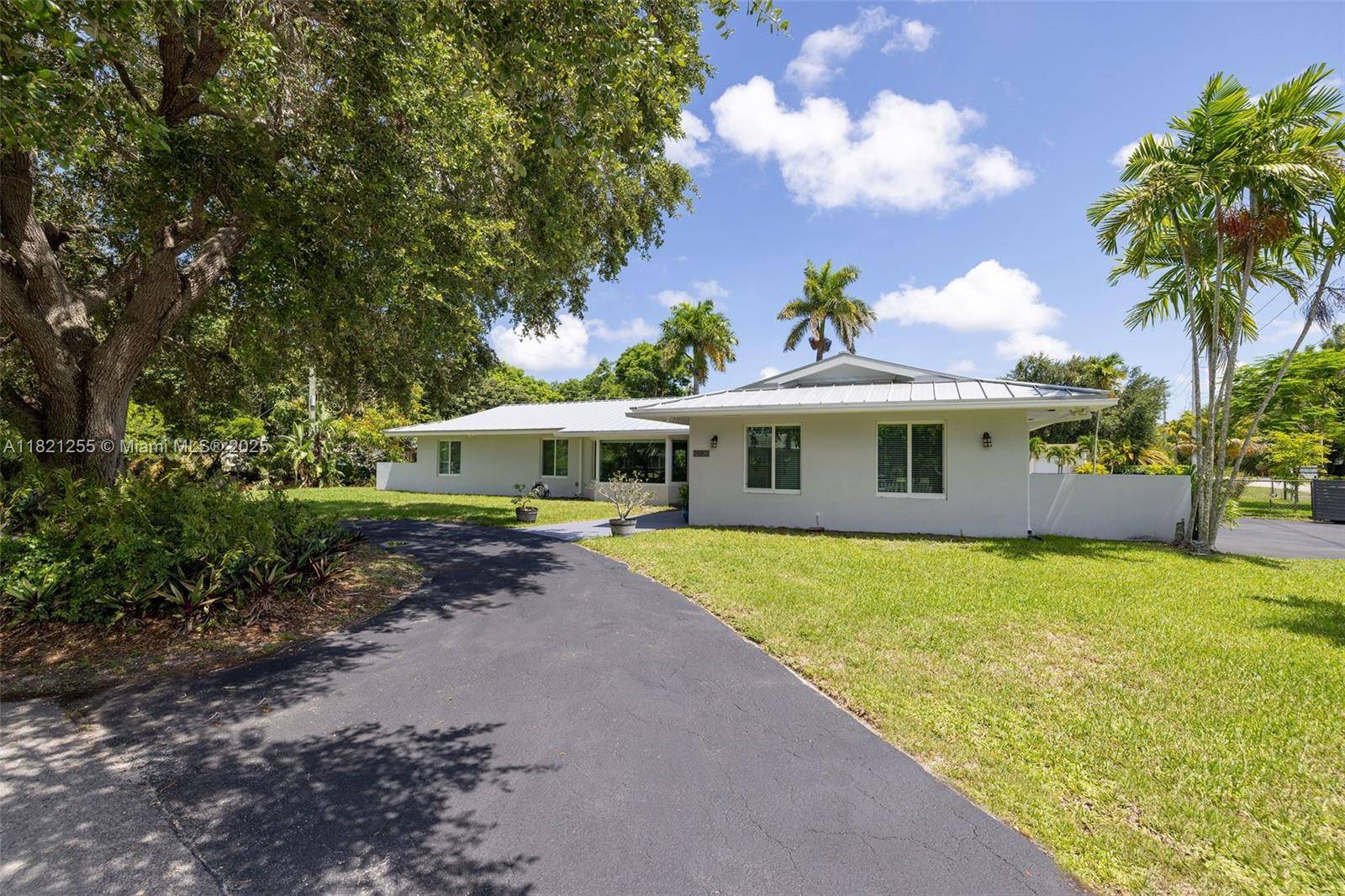 Welcome to Royal Palm Haven a serene escape nestled in the heart of Killian Green Estates.