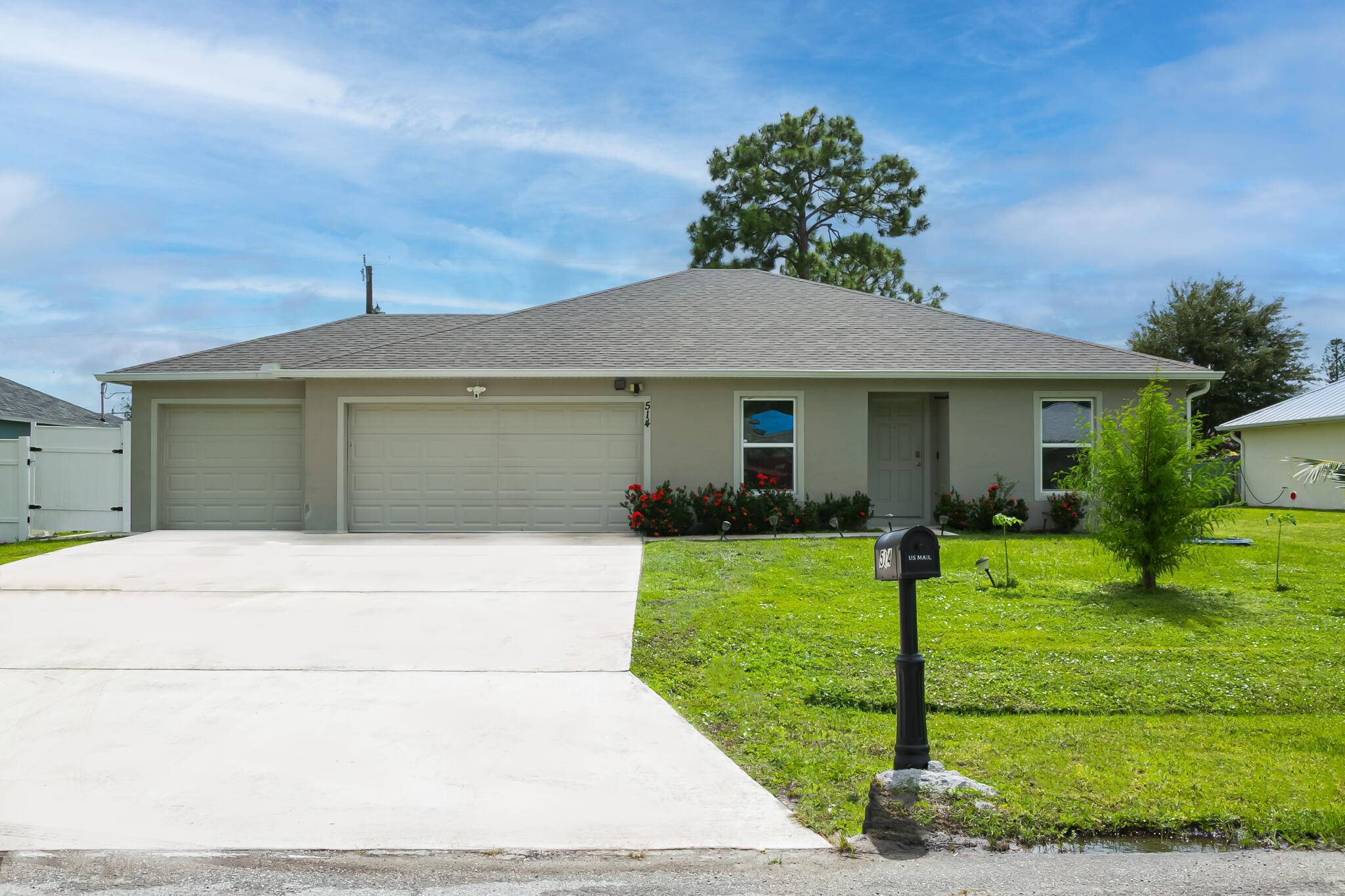 This 2022 home features three bedrooms, two bathrooms, a designated dining room, a den family room, and an unpermitted studio apartment occupying two thirds of the three car garage.