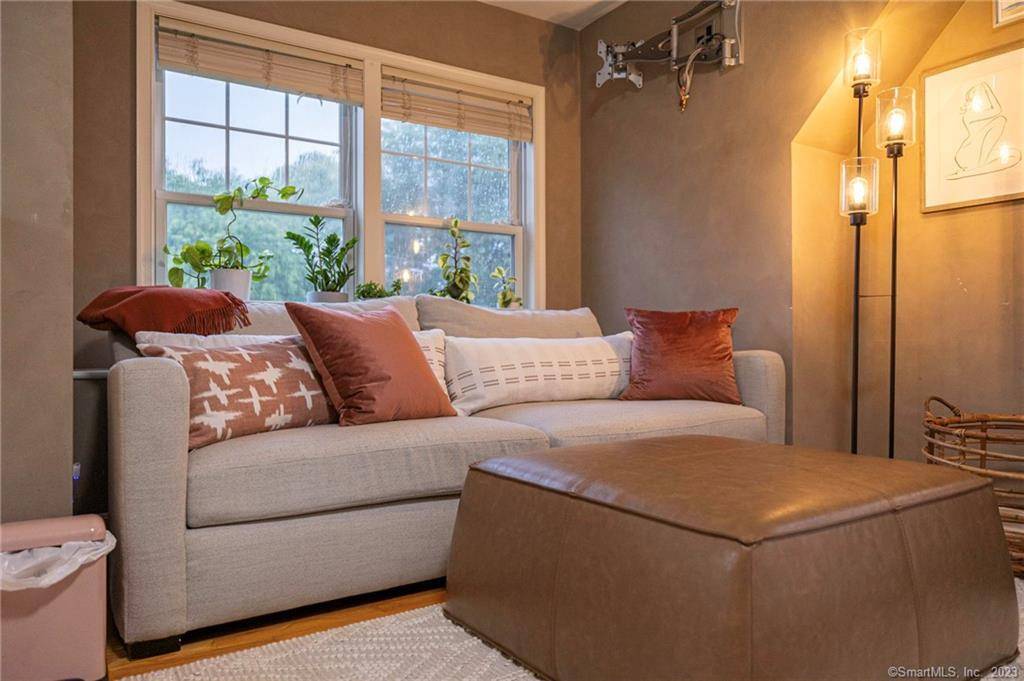 Welcome home to this stunning end unit townhouse at The Gables !