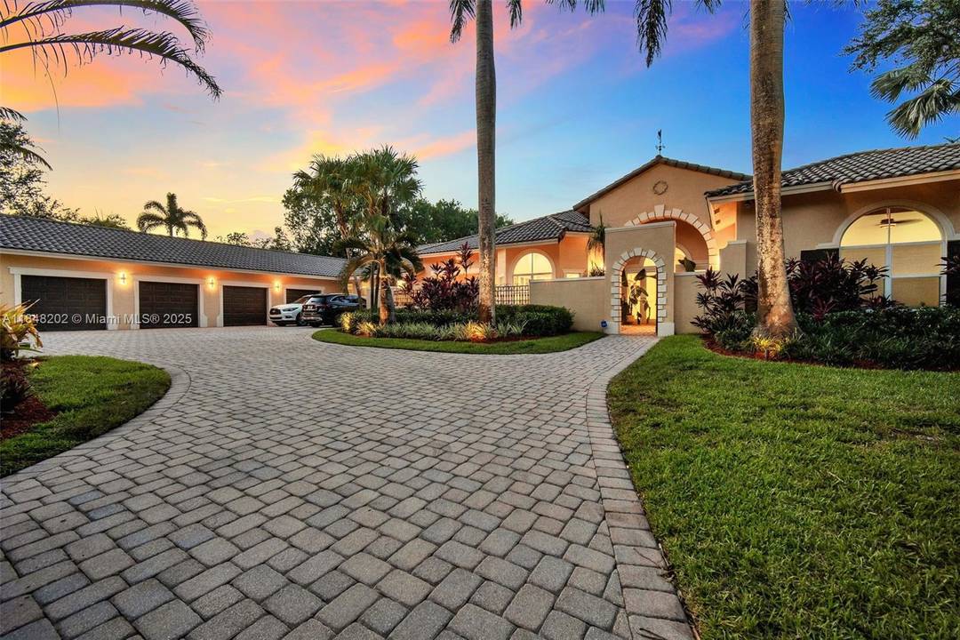 Gated 2. 24 acre estate in exclusive Sunshine Ranches offering unmatched privacy, space, and tropical luxury.