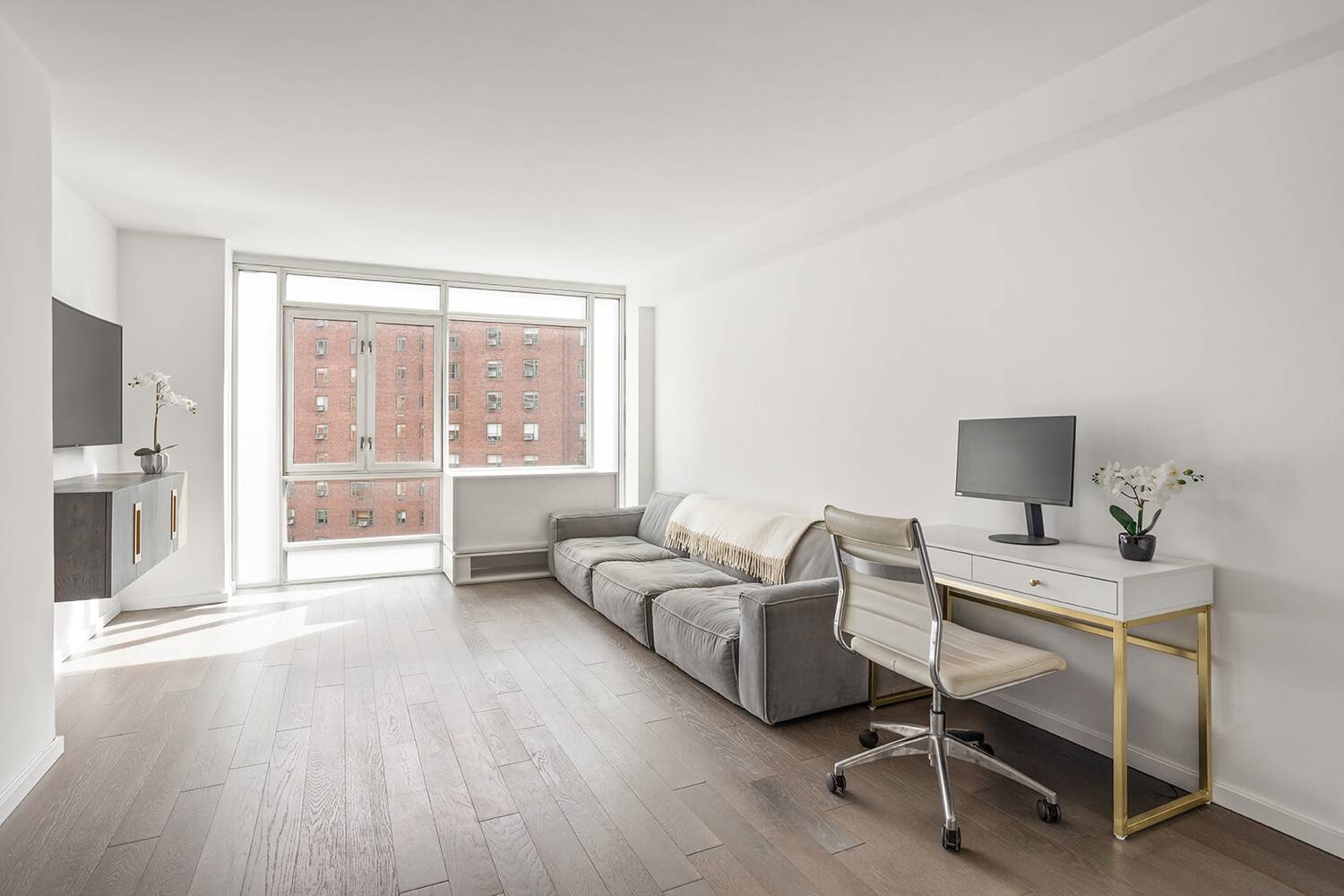 Located on the 7th floor of The Coda Condominium, this newly renovated one bedroom, one bath home offers a perfect balance of light, warmth, and modern sophistication.