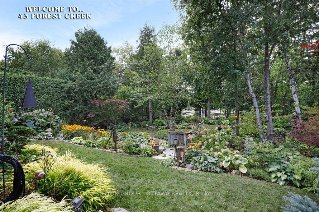 So much to love with this 3 bedroom 4 bathroom bungaloft in a VERY RARELY OFFERED LOCATION backing onto gardens, walking path, park and pond.