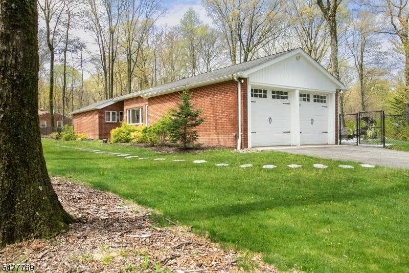 Welcome to this beautifully maintained ranch style home, perfectly set on a private, tree lined lot in one of Parsippany's most desirable locations.