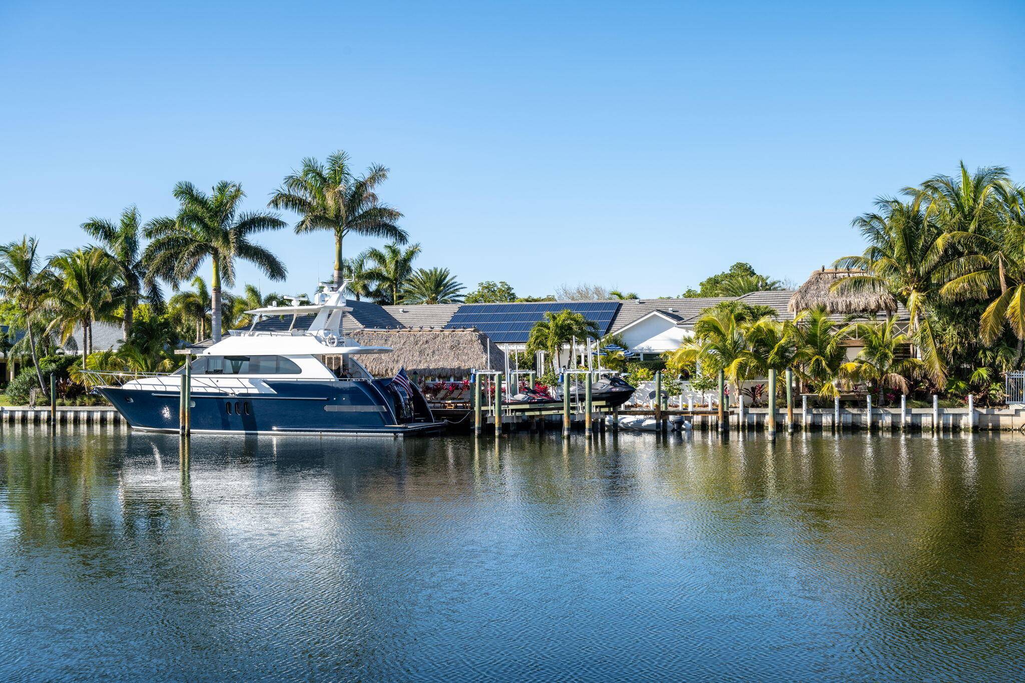 Over 184 feet of PROTECTED DEEP WATER frontage, a 98' Ipe wood dock, 24, 000 LB lift, quick access to the intracoastal, this IS a boater's dream !