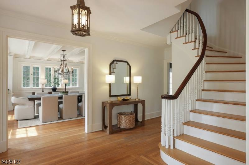 Majestically set on the iconic Boulevard, this classic Colonial welcomes you with a circular driveway timeless curb appeal.