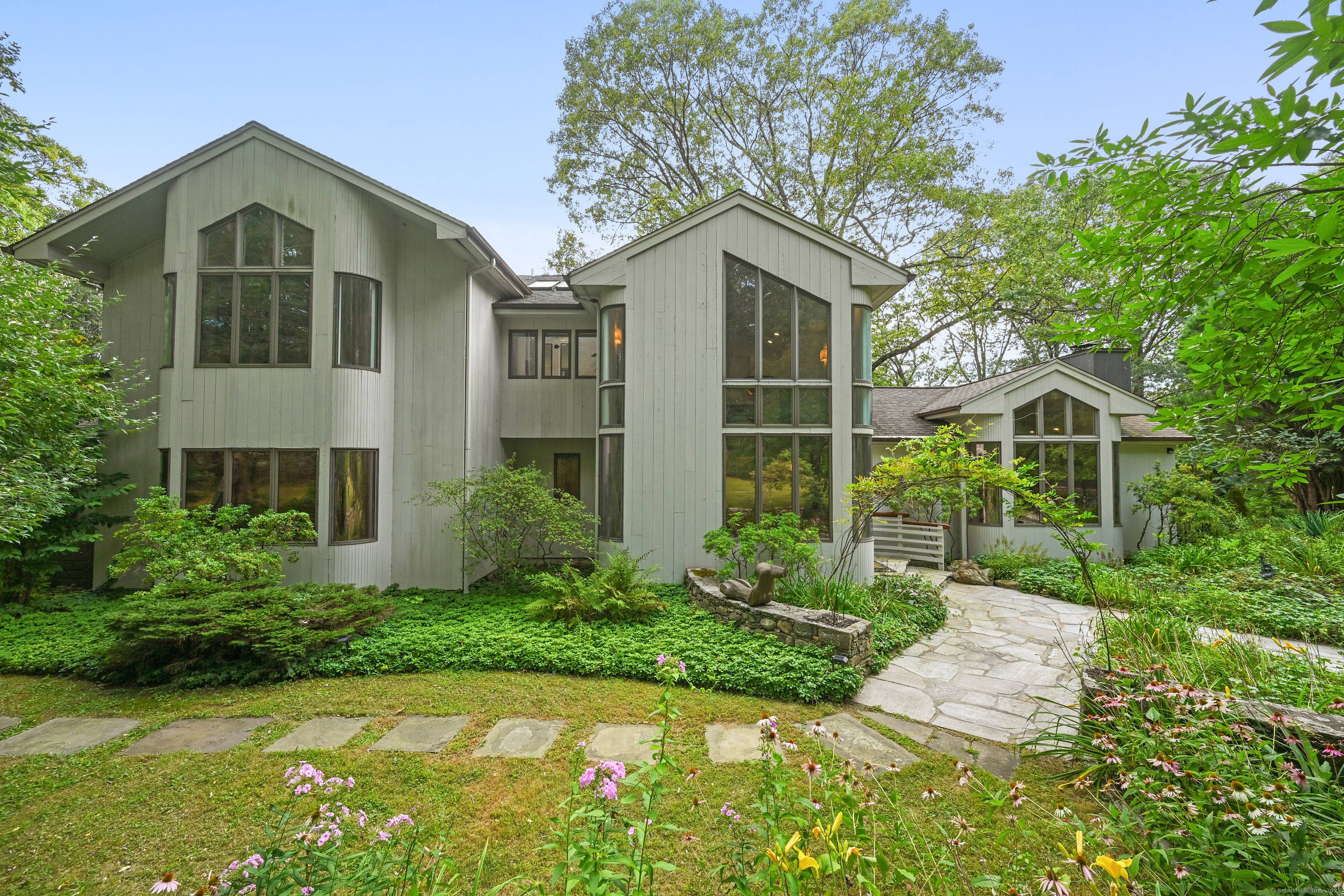 A celebrated artist's estate, this extraordinary mid century modern residence is a statement of design and lifestyle.
