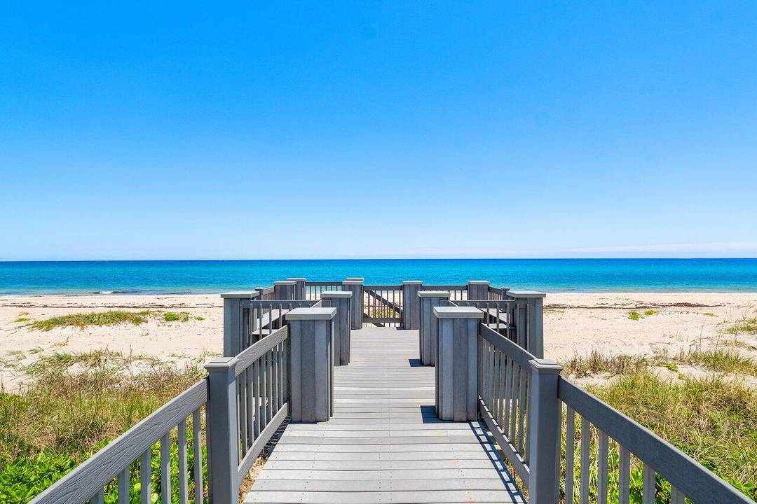 Dip your toes into the oceanfront sand on your private deeded beach in safe, secure Ocean Ridge, Florida.