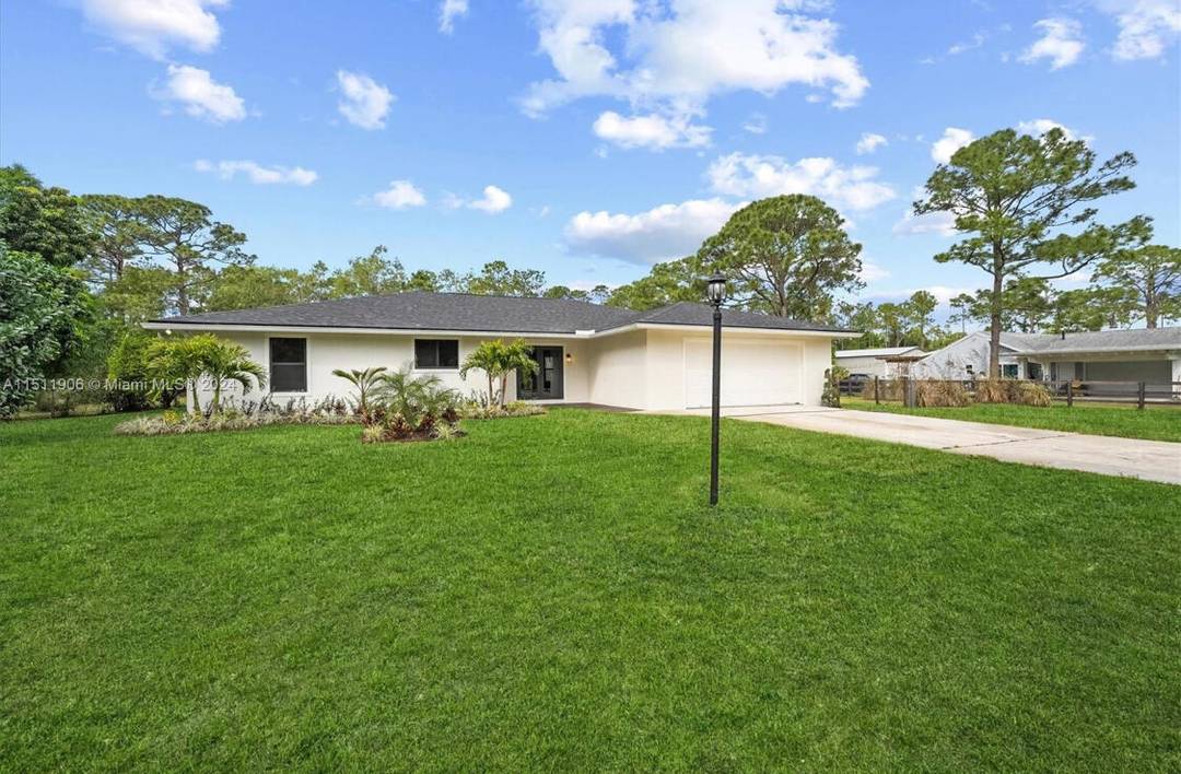 MOTIVATED SELLERS Welcome to this fully renovated oasis in the heart of Jupiter Farms !