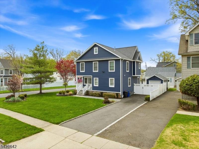 Welcome to 1420 Boulevard, where exceptional curb appeal and a welcoming front porch set the tone for this beautifully renovated Colonial on a prime Westfield street.
