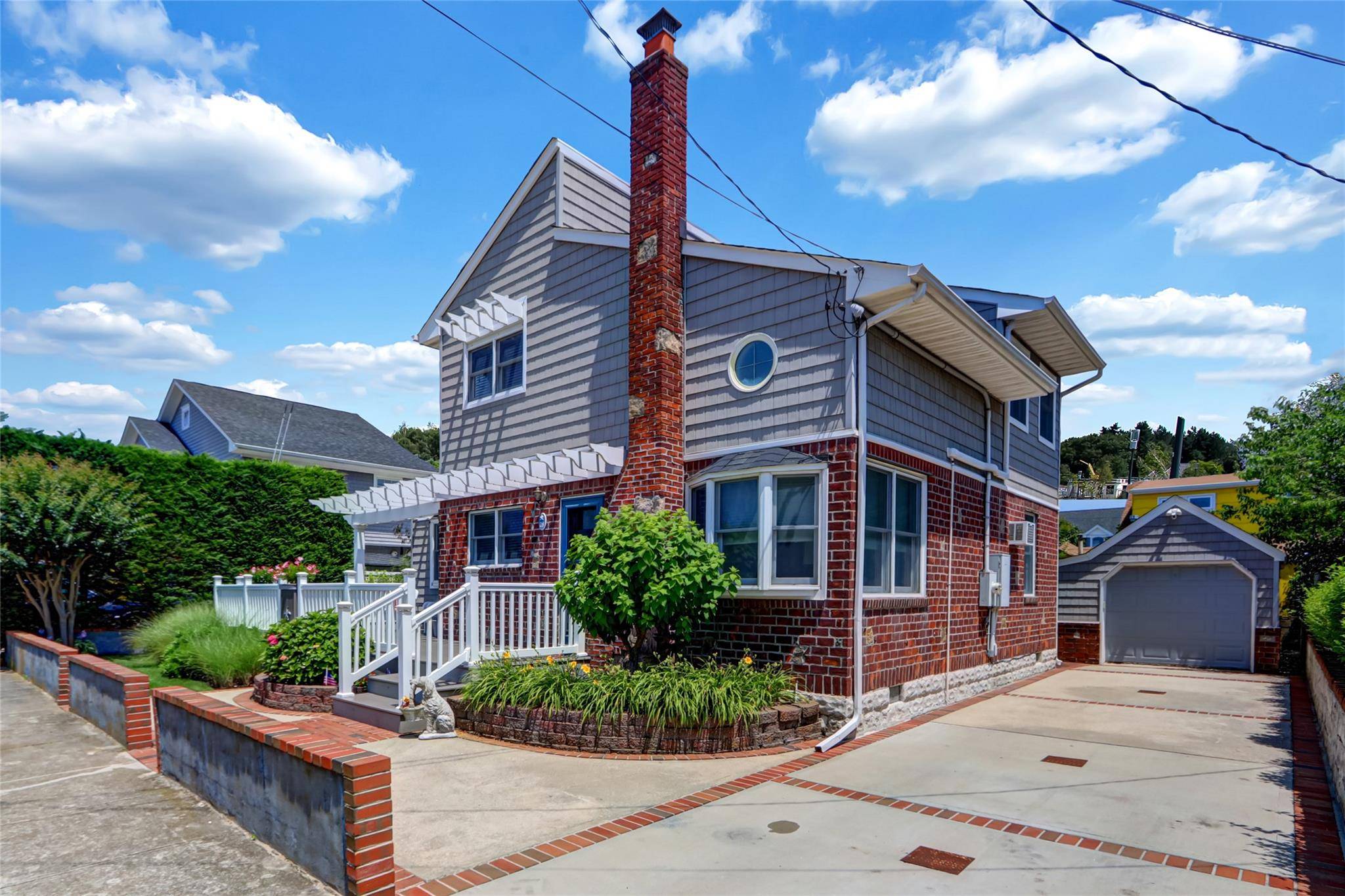 This Beautifully Updated Just Like New Beach Home features 4, 500' property surrounded by a concrete wall.