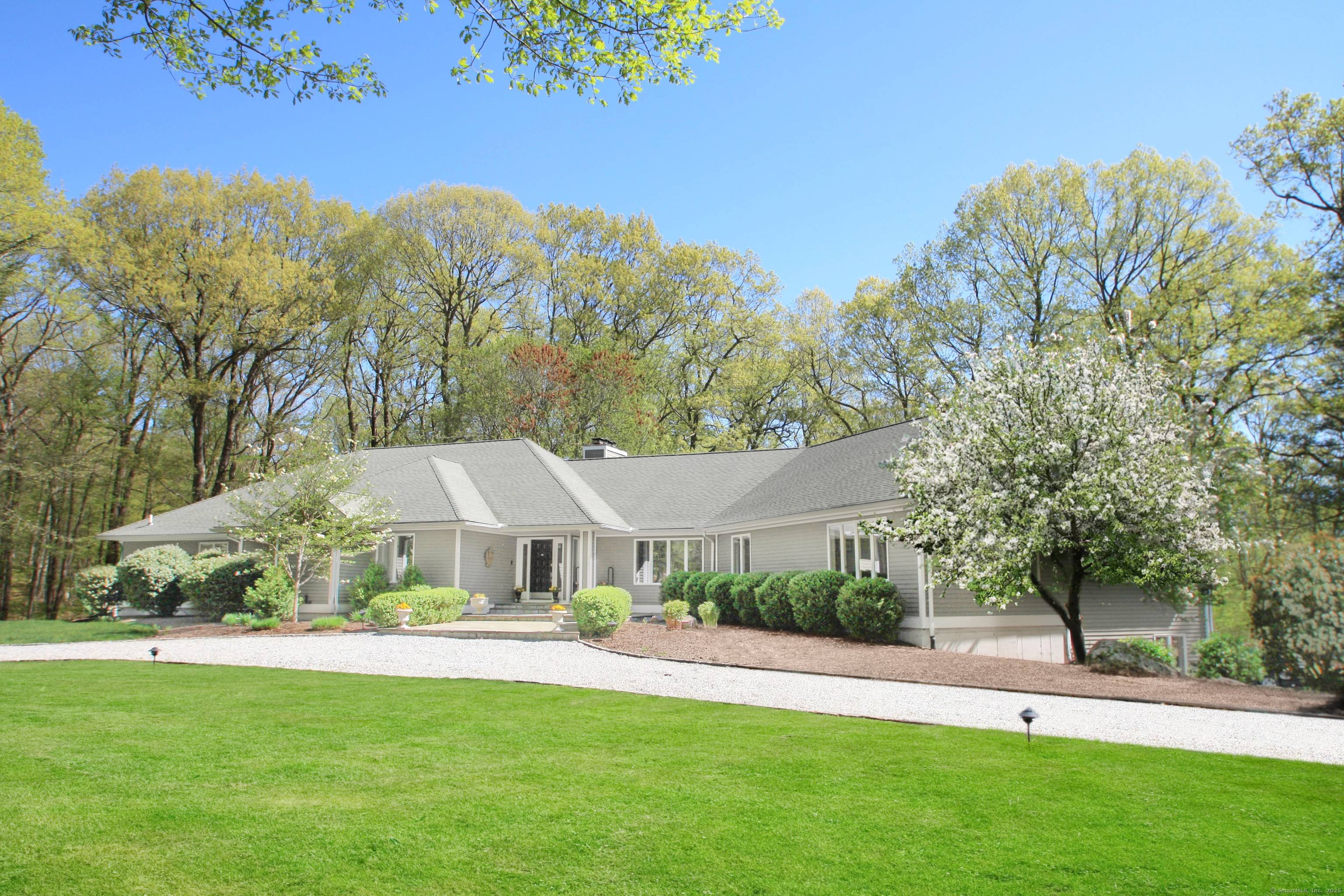 Just 60 miles east of New York City, on a quiet scenic country road in lower Easton's coveted Aspetuck Four Corners, nestled on 3 acres, is what appears to be ...