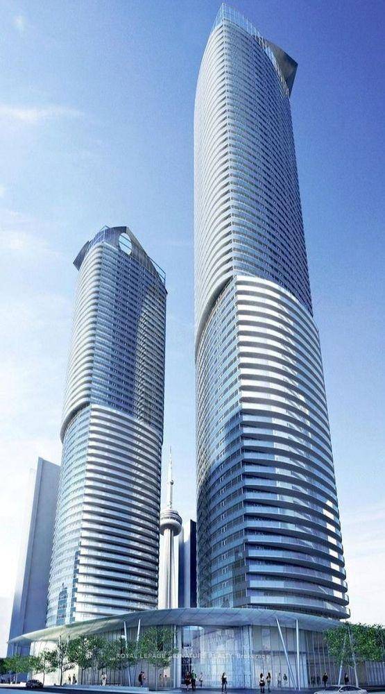 Rare 3 bed, 2 bath sanctuary at ICE Condos boasting breathtaking panoramic views of Lake Ontario, the CN Tower, and the dynamic city skyline through expansive floor to ceiling windows ...