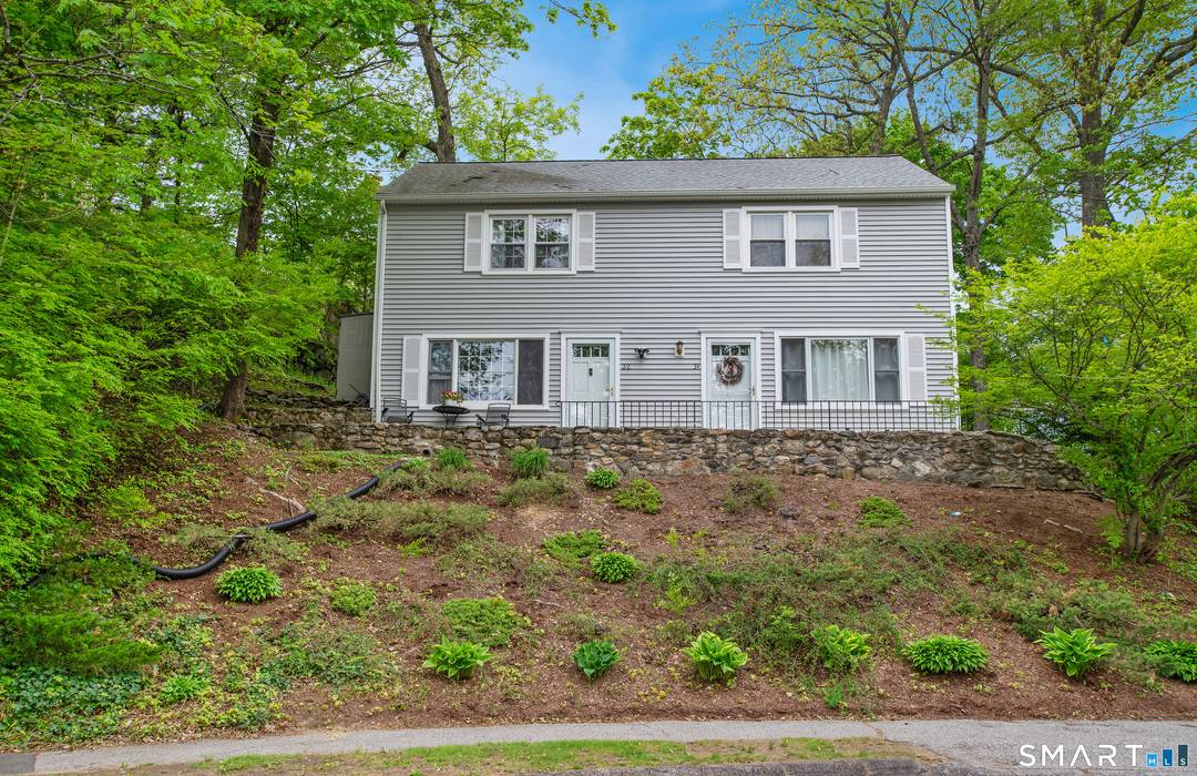 Tucked at the end of a quiet cul de sac, this bright 2 bedroom, 1.