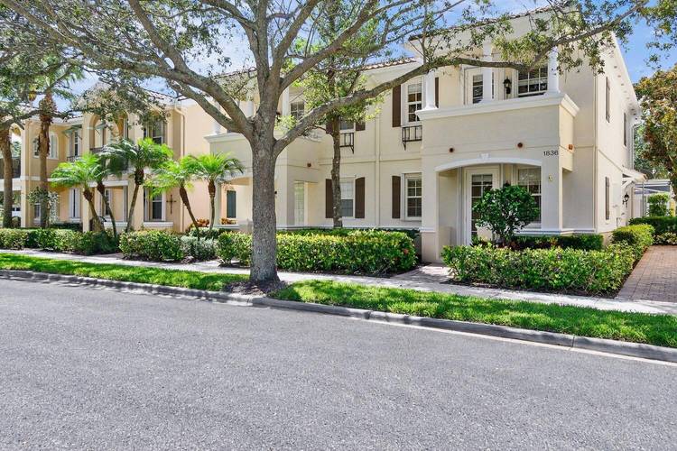 Enjoy the best of Abacoa in this beautifully maintained four bedroom, three bath townhome in Tuscany.