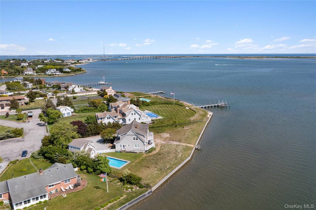 The essence of this waterfront beach house' southern exposure allows for magical sunrises and sunsets, a short ride to the ocean and numerous options for dining, shopping and world class ...