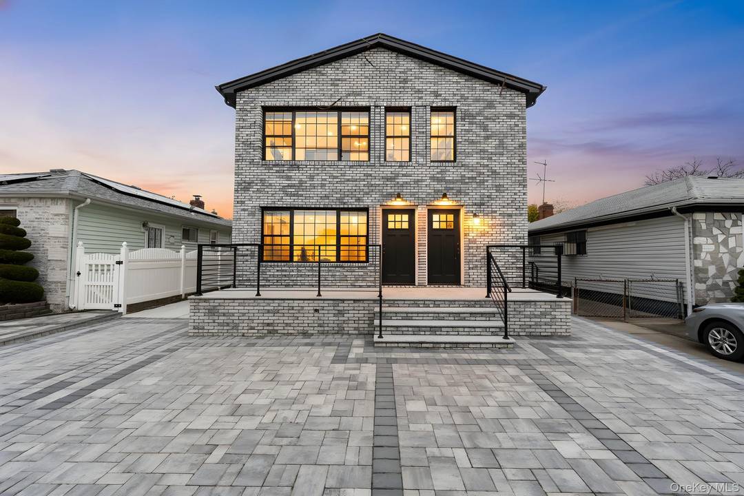 241 49 148th Drive is a meticulously renovated two family tucked away on a beautiful tree lined street of Rosedale.