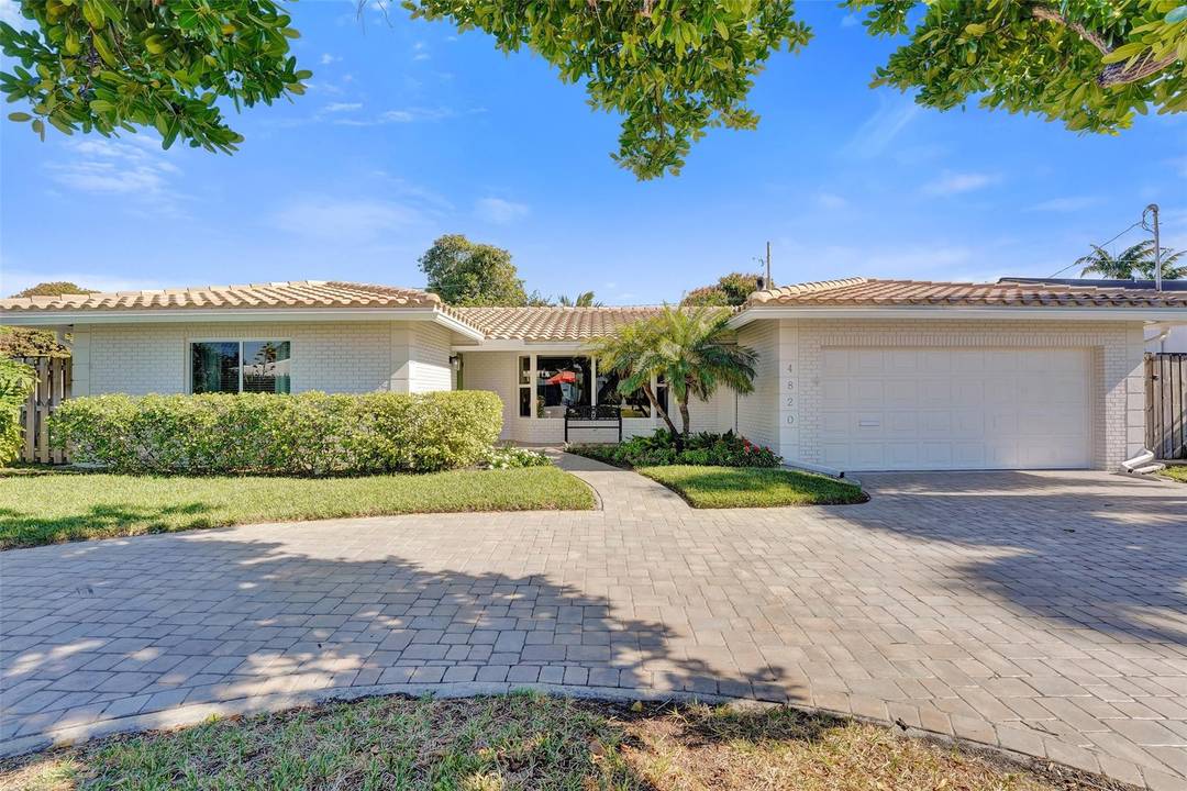 Enjoy this beautifully updated Coral Ridge home with stunning pool views from the living room, family room, kitchen and bedroom.