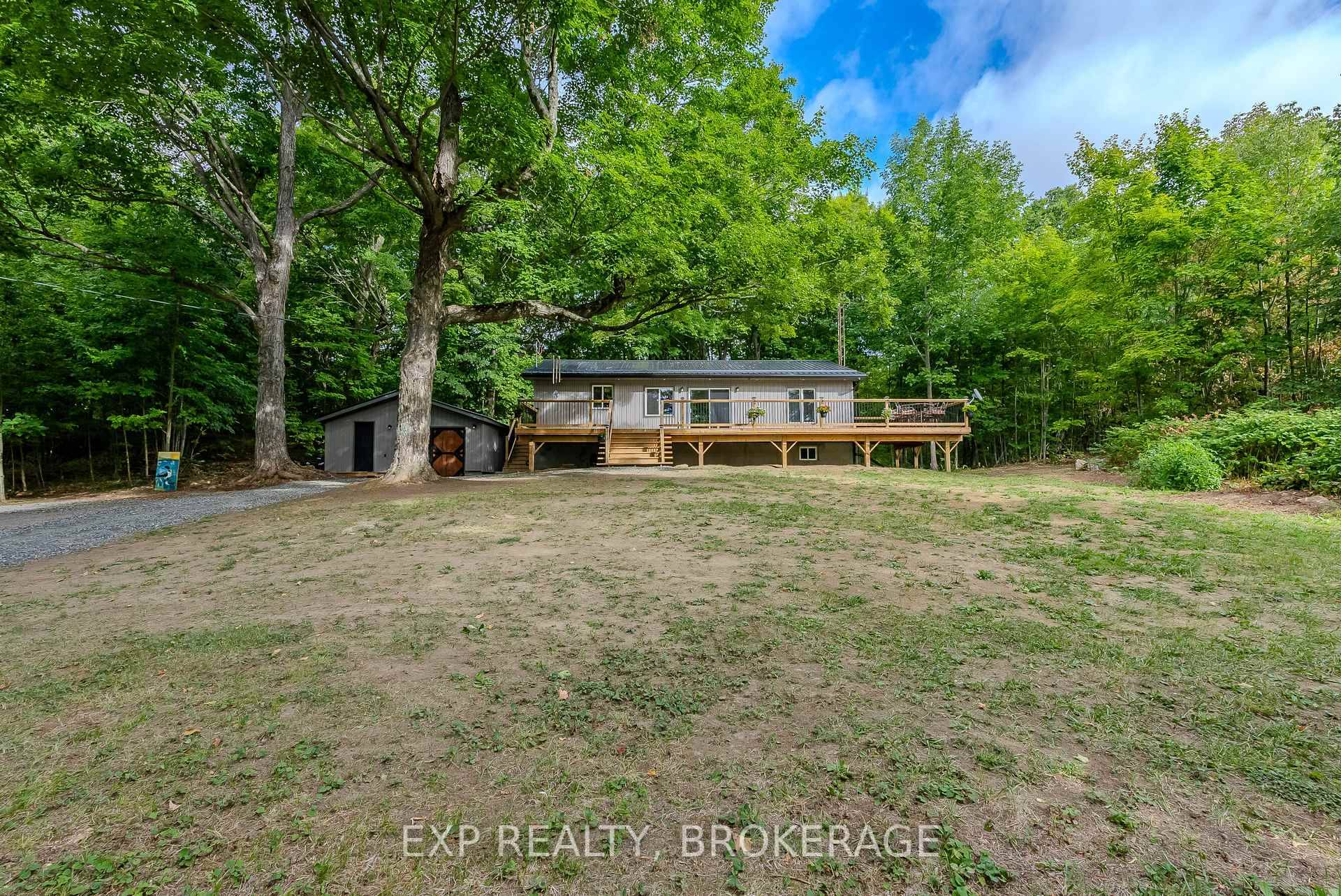 Embrace the charm of this renovated home everything is new from top to bottom 2024 Relax on the 50ft porch that has seasonal views of Big Clear Lake minutes to ...