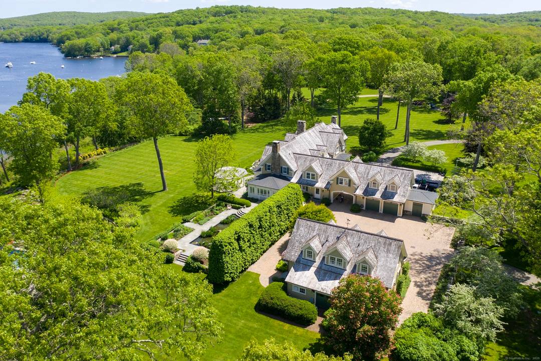 A timeless aesthetic and a sensibility respecting nature have resulted in an eminently livable, grand and gracious waterfront country house overlooking spectacular views of Hamburg Cove in sylvan Lyme, Connecticut.