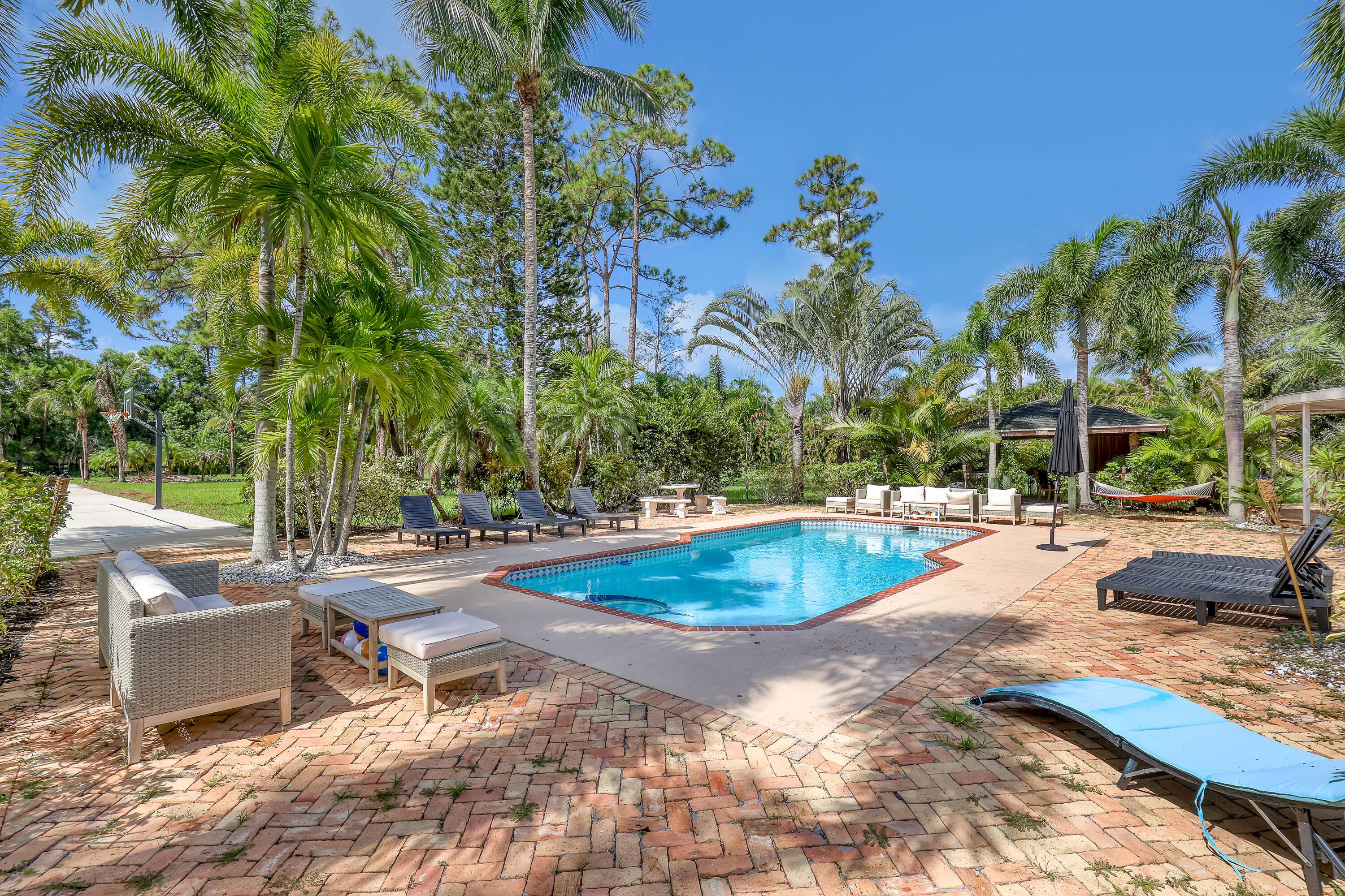 Must see Wellington Estate on over 5 acres, perfect blend of luxury, privacy resort style seasonal living.