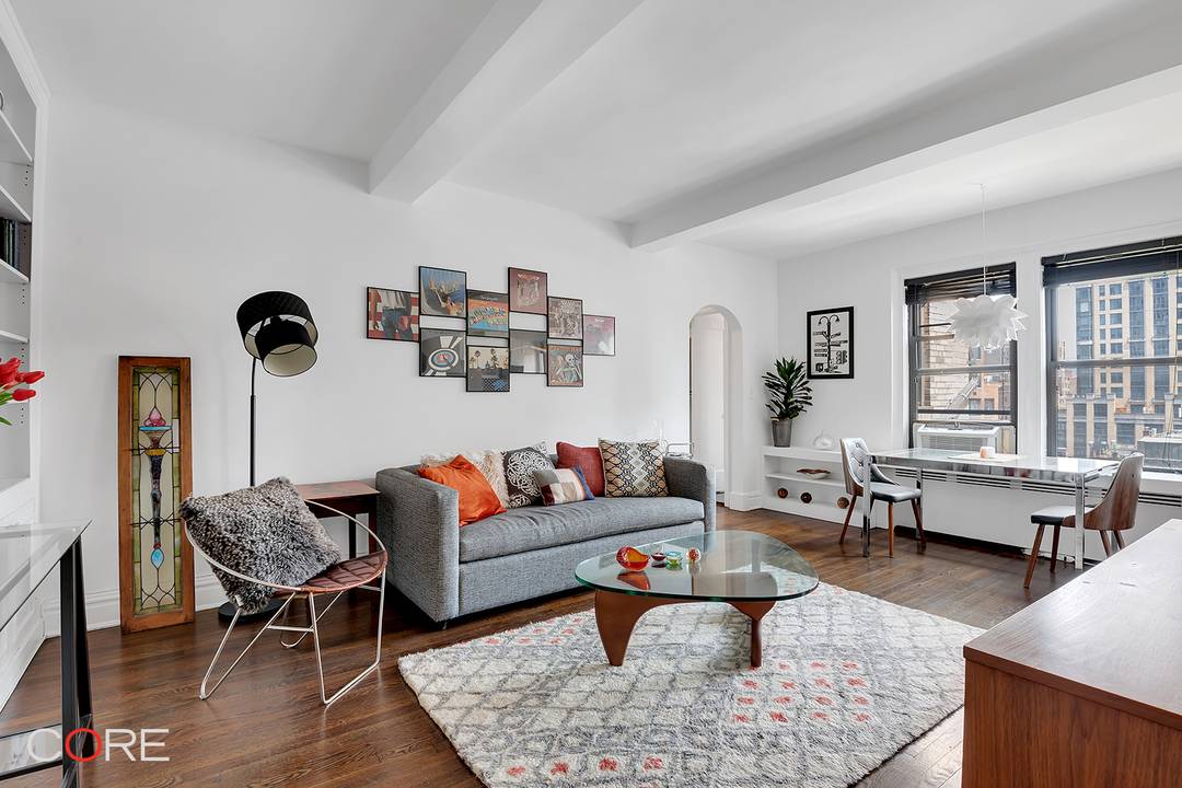 Residence 12G is a meticulously renovated one bedroom home that blends pre war charm with modern convenience, featuring high beamed ceilings, arched entryways, and large windows that bathe the space ...