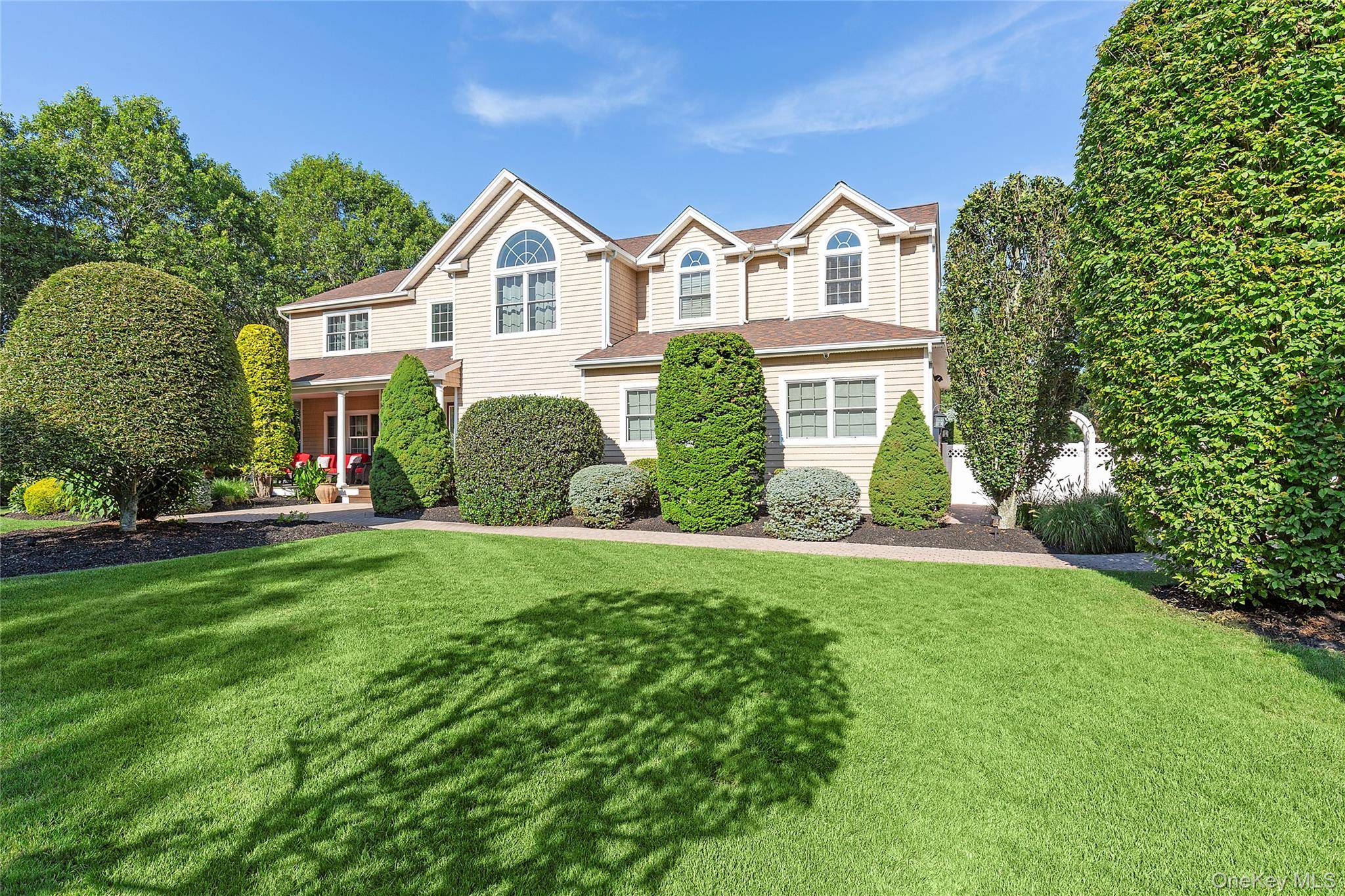 Welcome to this stunning custom home in Center Moriches perfectly situated a beautifully manicured acre !