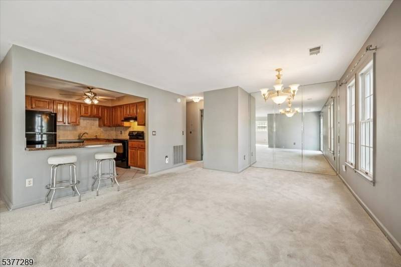 Welcome to this sunny, top level end unit Chesterfield II model offering 1 bedroom plus a versatile den, perfect for a home office, guest room, or hobby space.
