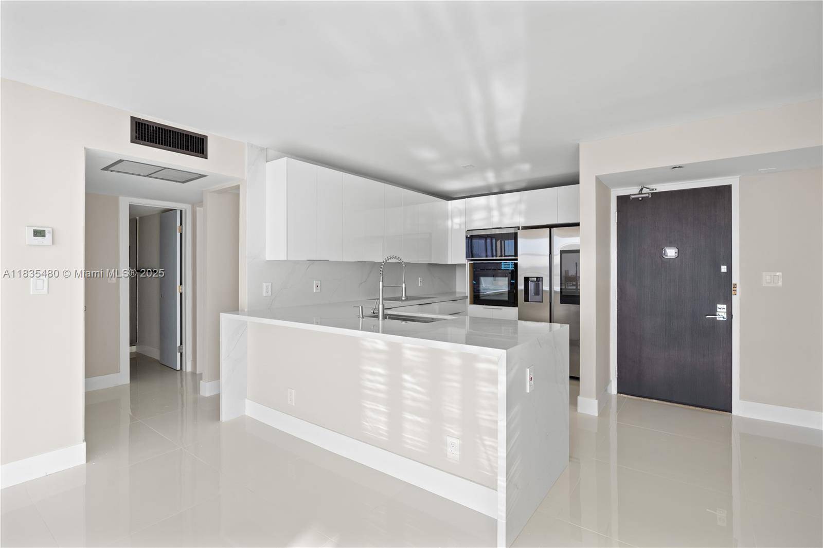 Discover your dream home in this fully upgraded 15th floor corner unit with breathtaking panoramic views of the Turnberry Golf Course, Intracoastal, and ocean.