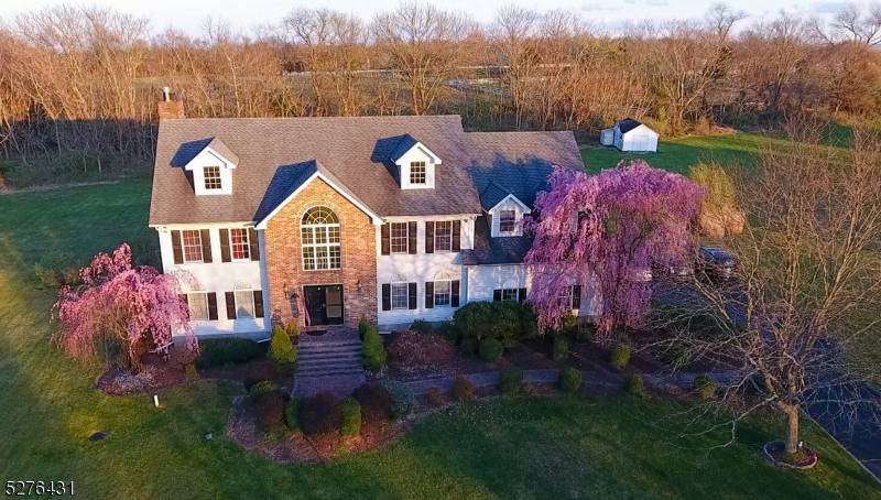 Expansive Foyer with two story high ceiling case greets you into this beautiful Sun filled builder's model home of 3800 sq ft !