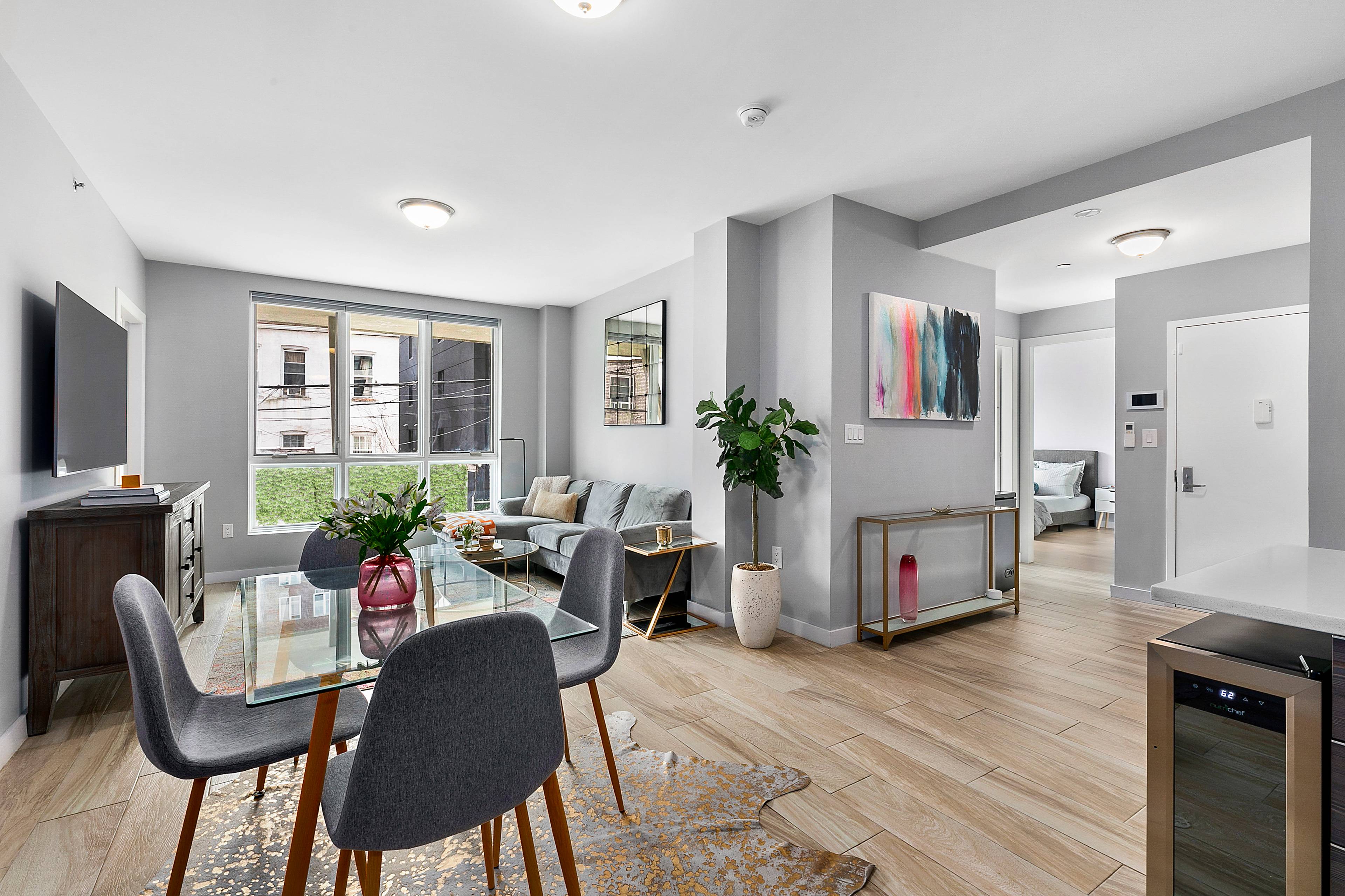 Sun soaked Beauty ! Pristine and spacious 3 bed 2 bath condo with deeded PARKING !