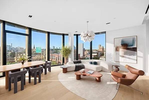 A Corner Three Bedroom with Dramatic Light and Skyline Views The custom kitchen by LAGO is elegantly recessed and fully outfitted with veined Mario Arredo quartz countertops, Canaletto walnut cabinetry, ...