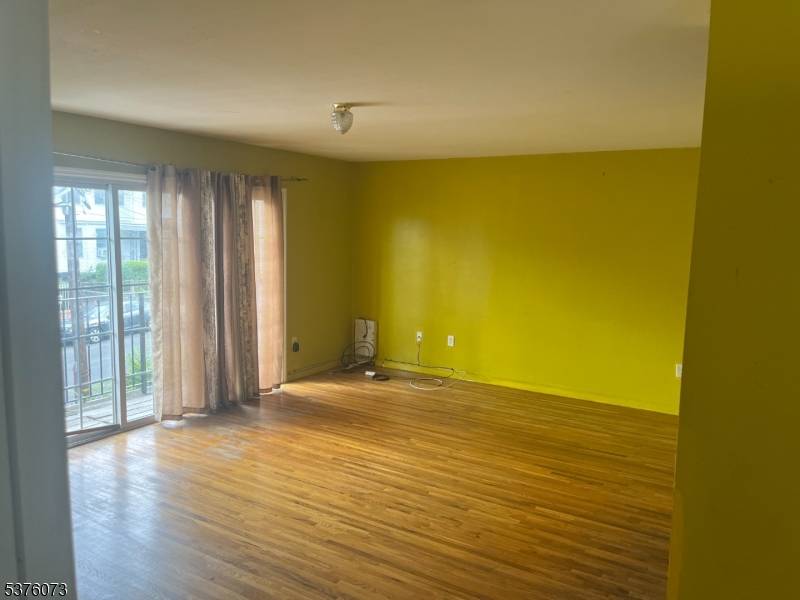 Discover an exceptional investment opportunity with this expansive three family residence, ideally situated on an oversized lot just steps from I 78, the Garden State Parkway, and key transit options.