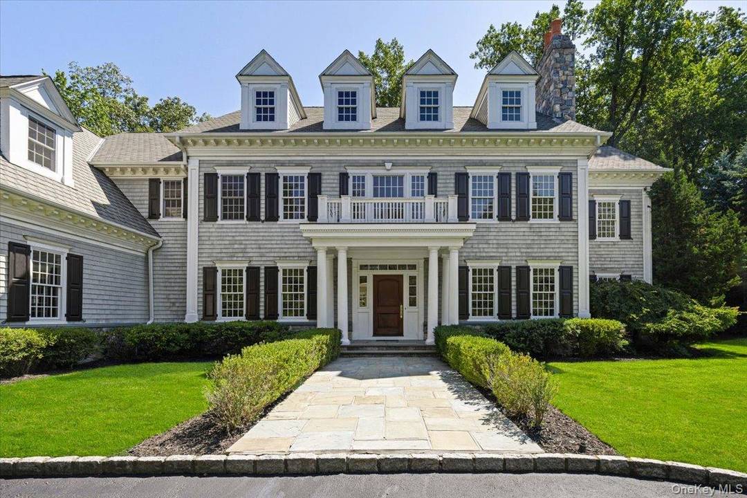 Welcome to 1 Cedar Lane, an elegant shingle style Colonial nestled in the prestigious Purchase Estates.