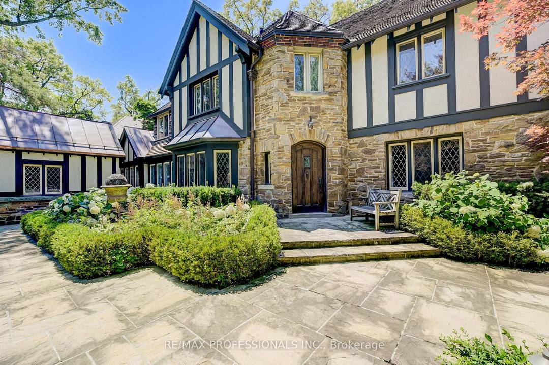 Magnificent R. Home Smith Tudor set on an elevated lot across from the Humber River Valley.