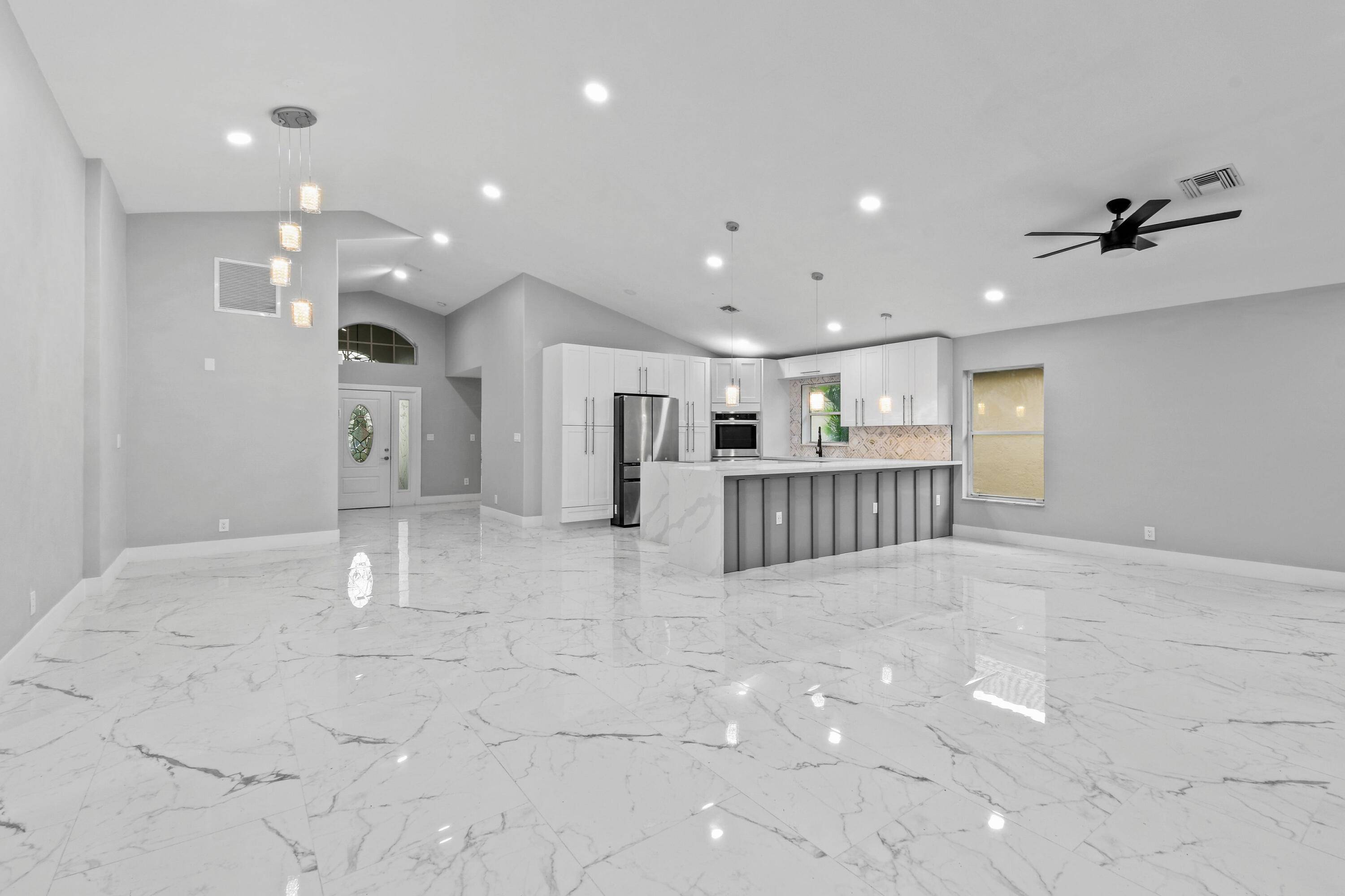 Beautifully FULLY RENOVATED single family home in the desirable gated community of Newport Cove !