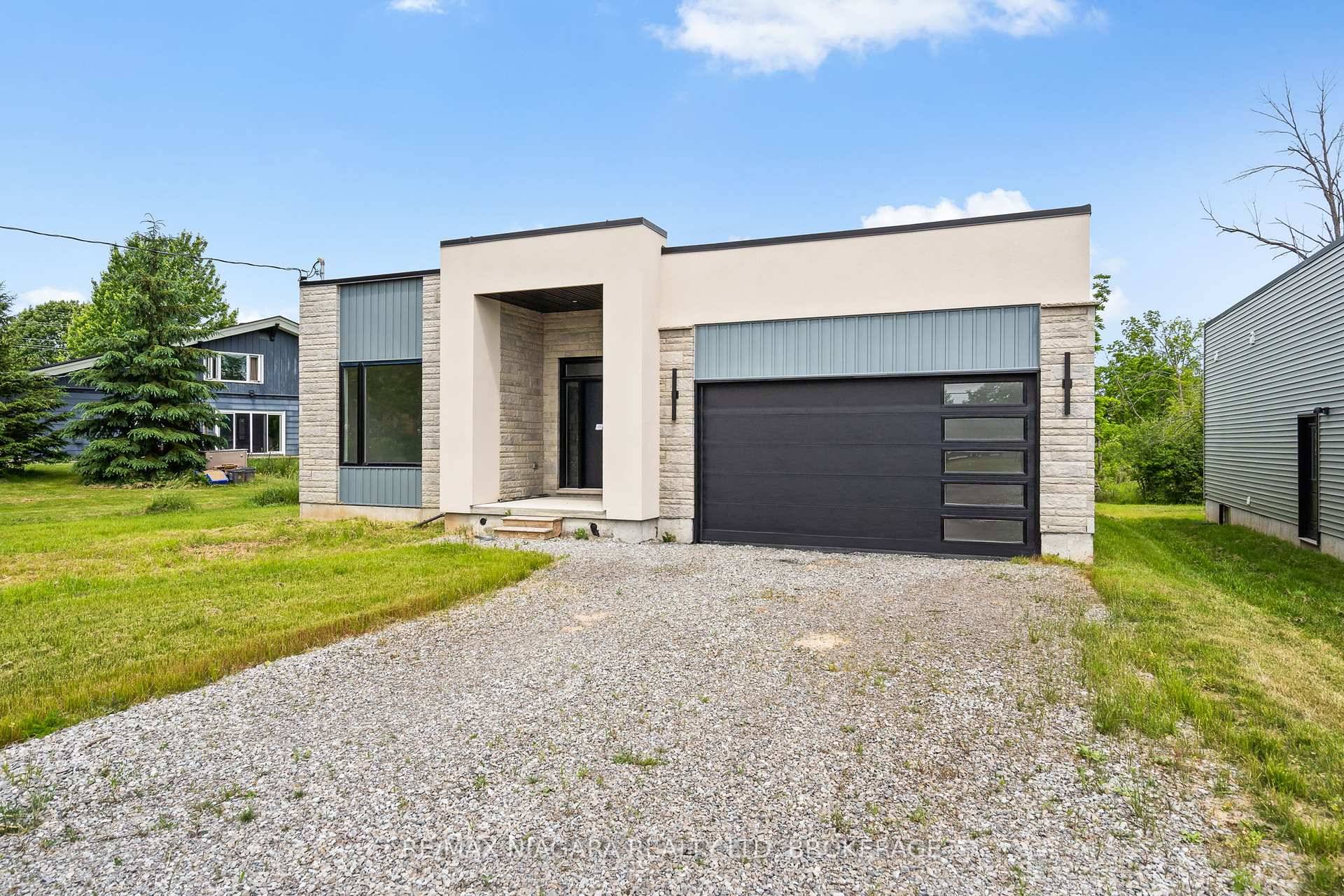 Be the first to live in this never lived in 3 bedroom, 2 bathroom bungalow featuring tall ceilings, a cozy fireplace, and a spacious kitchen with a pantry.
