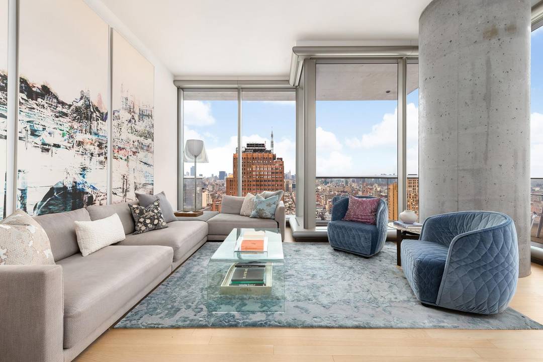 Step into a world of light, space, and luxury in this expansive three bedroom residence, perched high above Tribeca with panoramic skyline and river views.