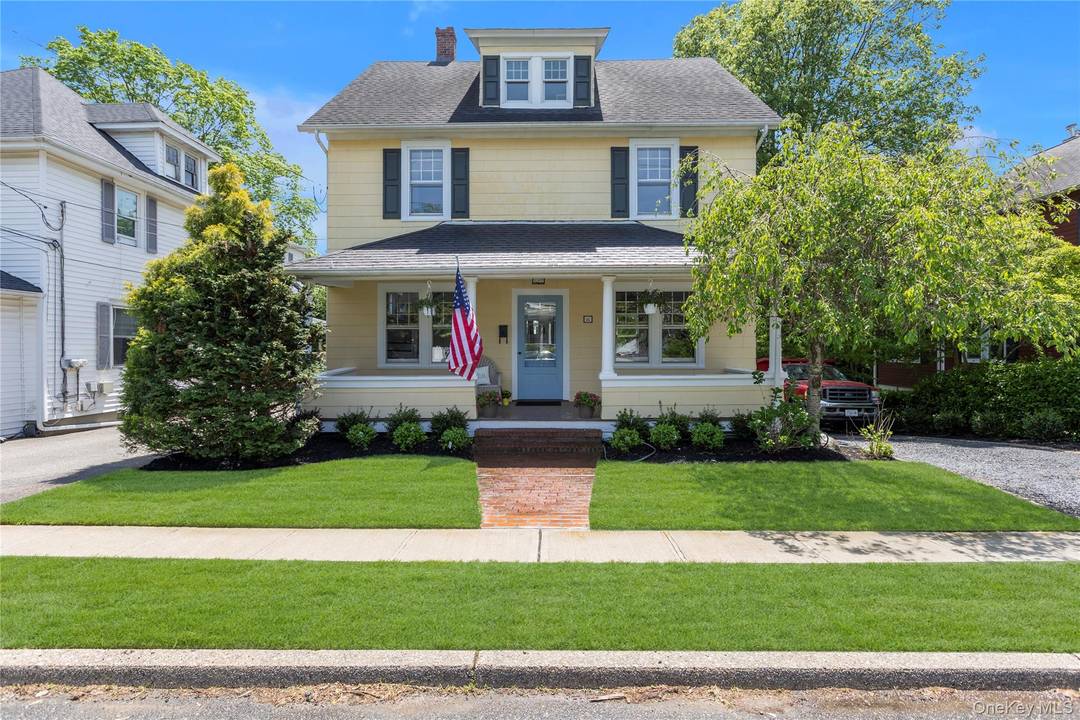 Nestled in the heart of Huntington Village, this 1914 Victorian home exudes timeless charm.