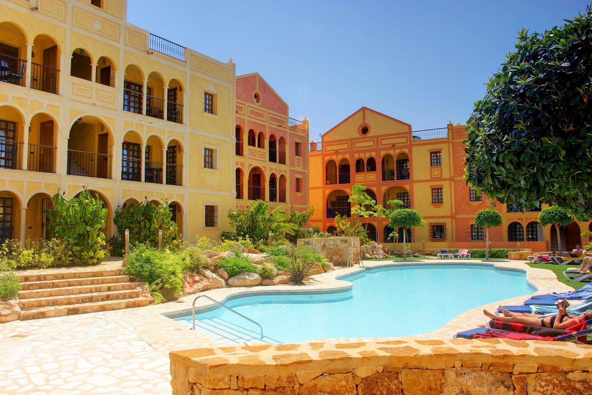 STUNNING NEW APARTMENTS IN DESERT SPRINGS RESORT Stunning three bedroom first floor apartments located within a Spanish style courtyard with communal 