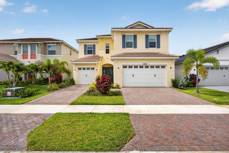 Waterfront living awaits in this two story, four bedroom residence located in Pines of Westlake.