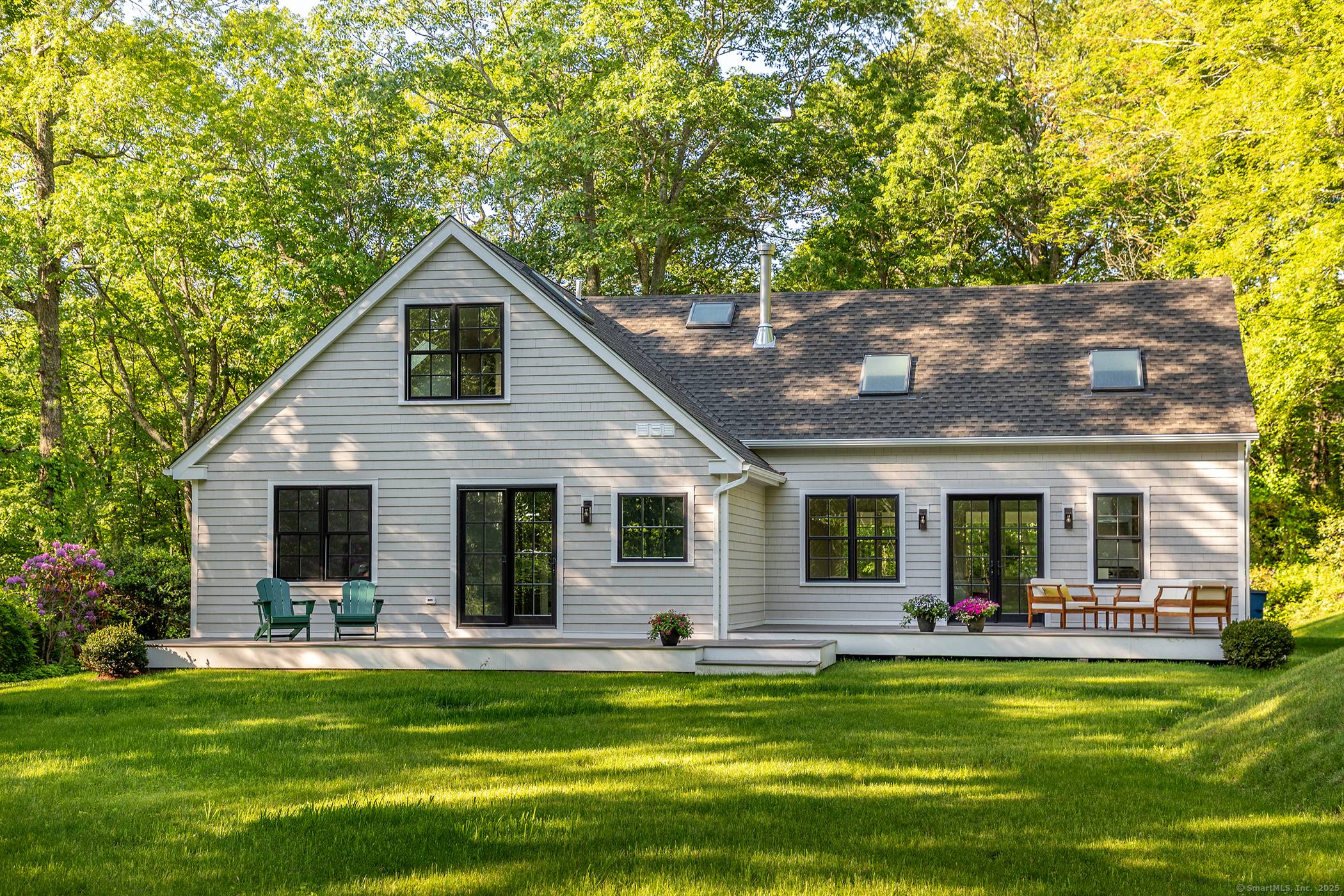 Mint move in ready ! Superbly designed and beautifully built Nantucket shingle style cape on a large private lot, nestled in coveted Washington.