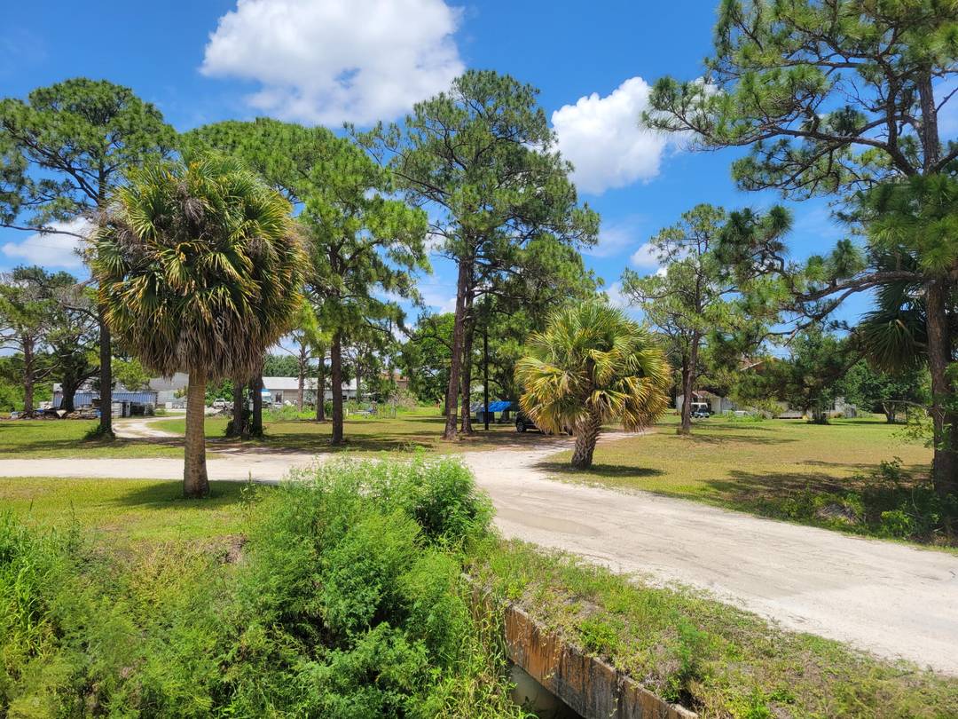 4. 85 Acres several hundred ft East of Turnpike overpass on the North side of Orange Ave.
