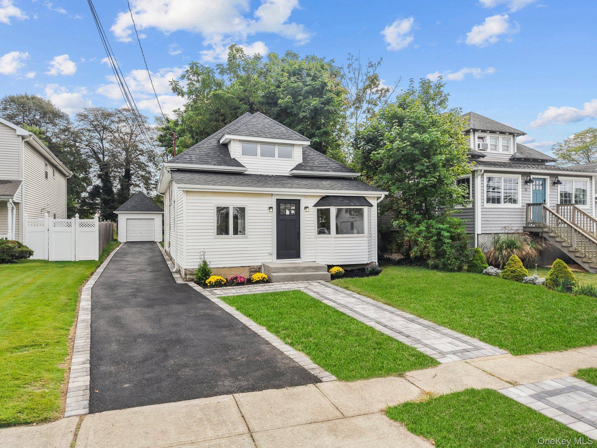 Welcome to the epitome of Nassau County living just a few blocks from the Great South Bay, nestled on a quiet, highly desirable block.