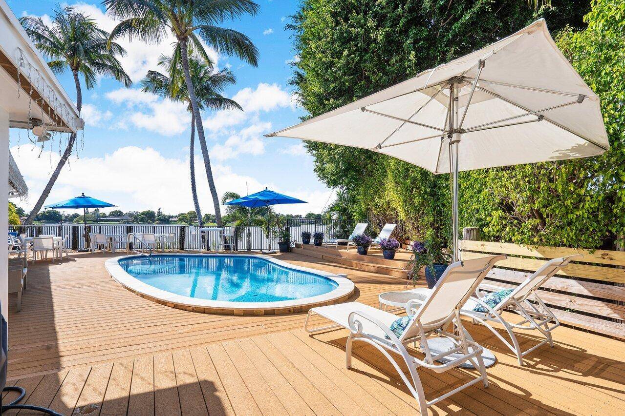 Nestled on a cul de sac overlooking Lake Ida, this waterfront property offers a perfect blend of serenity and sophistication.